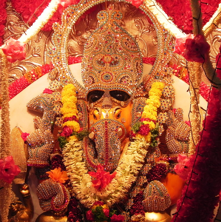 Ganesha sits on the left front.