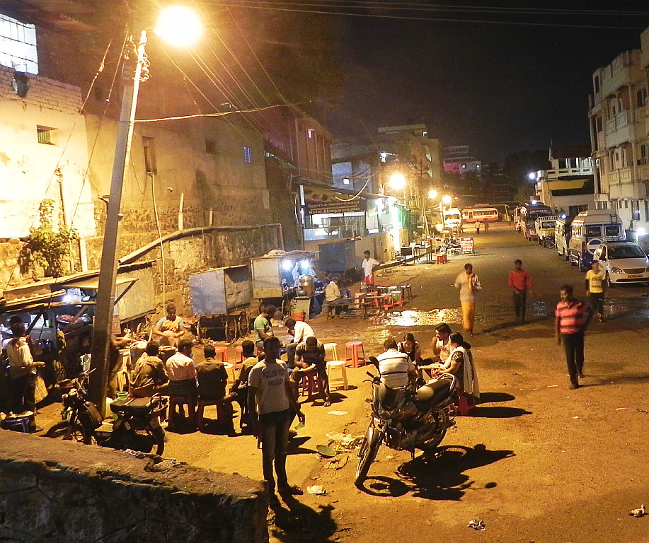 Street cafes in Kanyakumari serving evening meals.